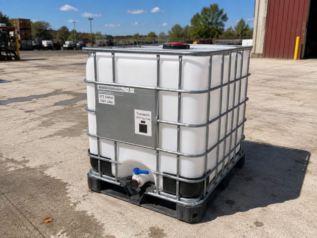 A single clean 275 gallon caged IBC tote showing its data plate marked 275 Gallon 1041 Liter and Transport 1650 kg max