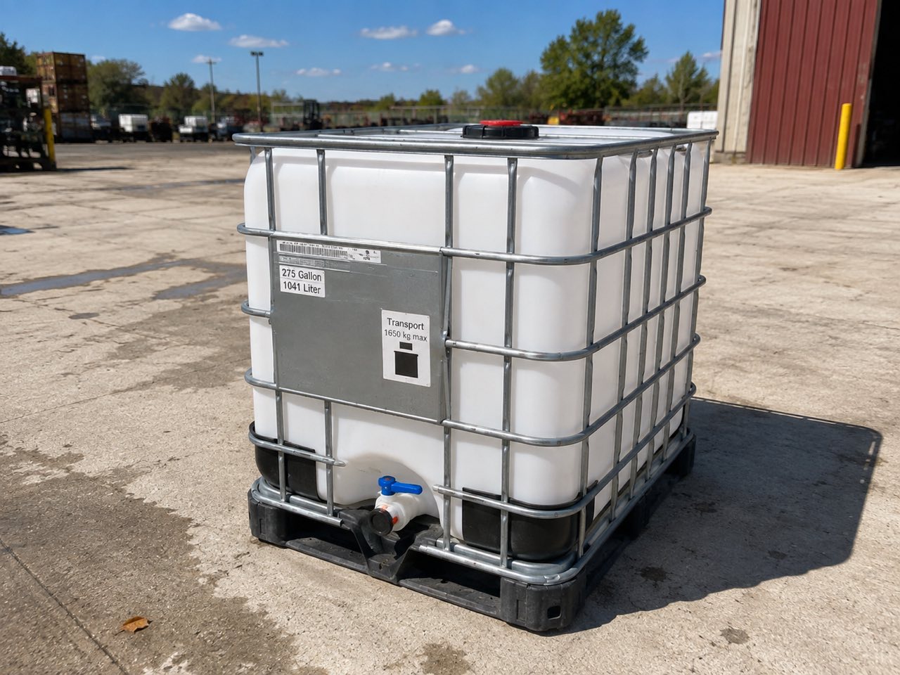 A single clean 275 gallon caged IBC tote showing its data plate marked 275 Gallon 1041 Liter and Transport 1650 kg max